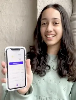 Girl showing the Spriggy app on her phone